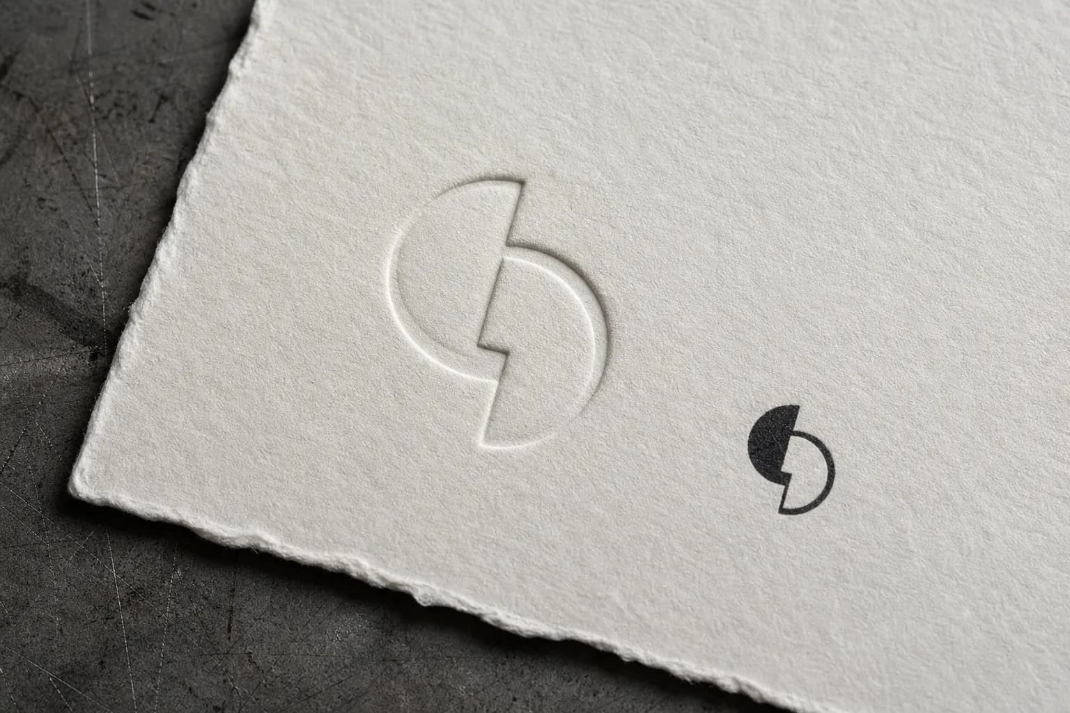 Geometric logo mark explored in black and white on a studio board.