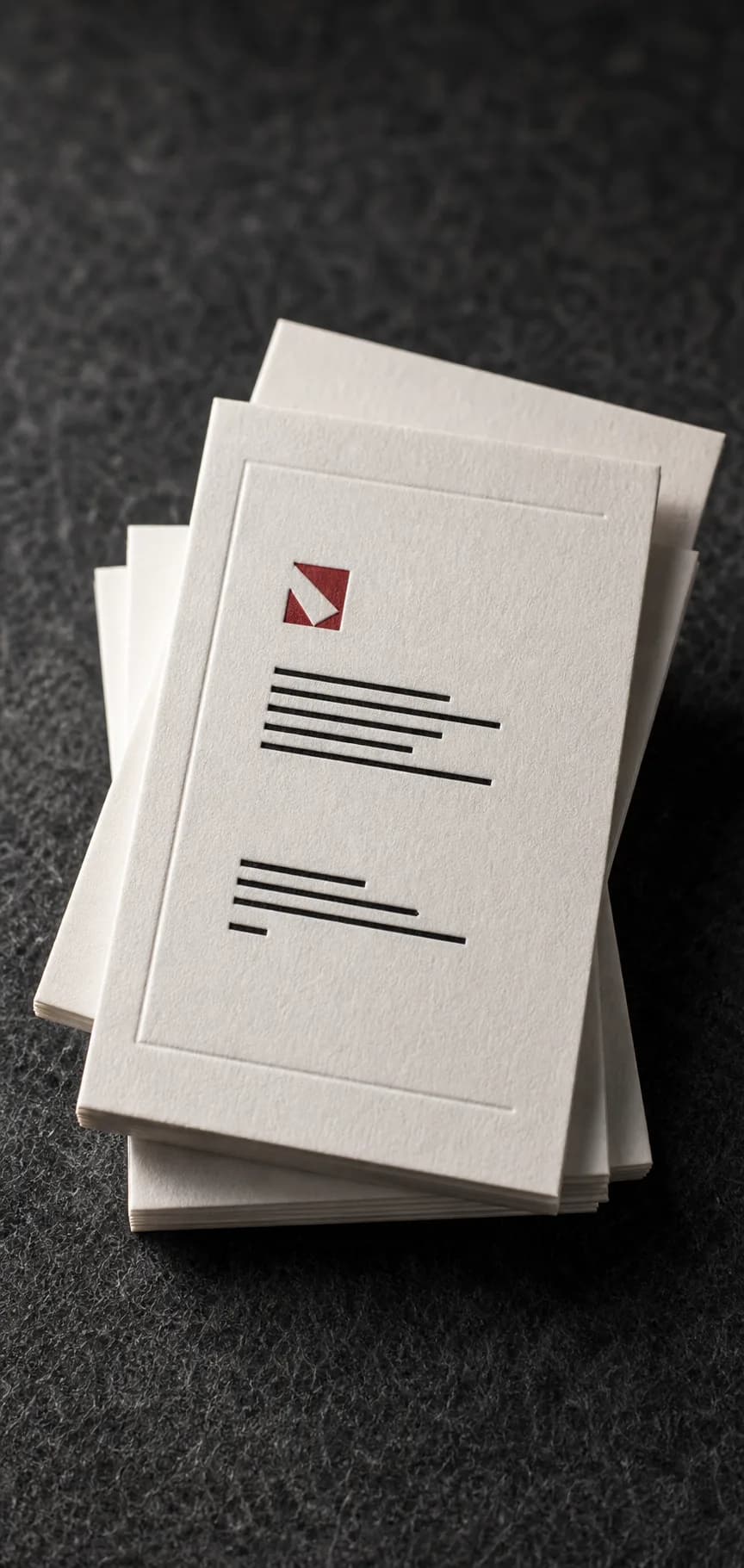 Minimal business cards with precise typography and a natural paper finish.